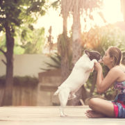 women hugging a dog and kiss. them playful and happiness.