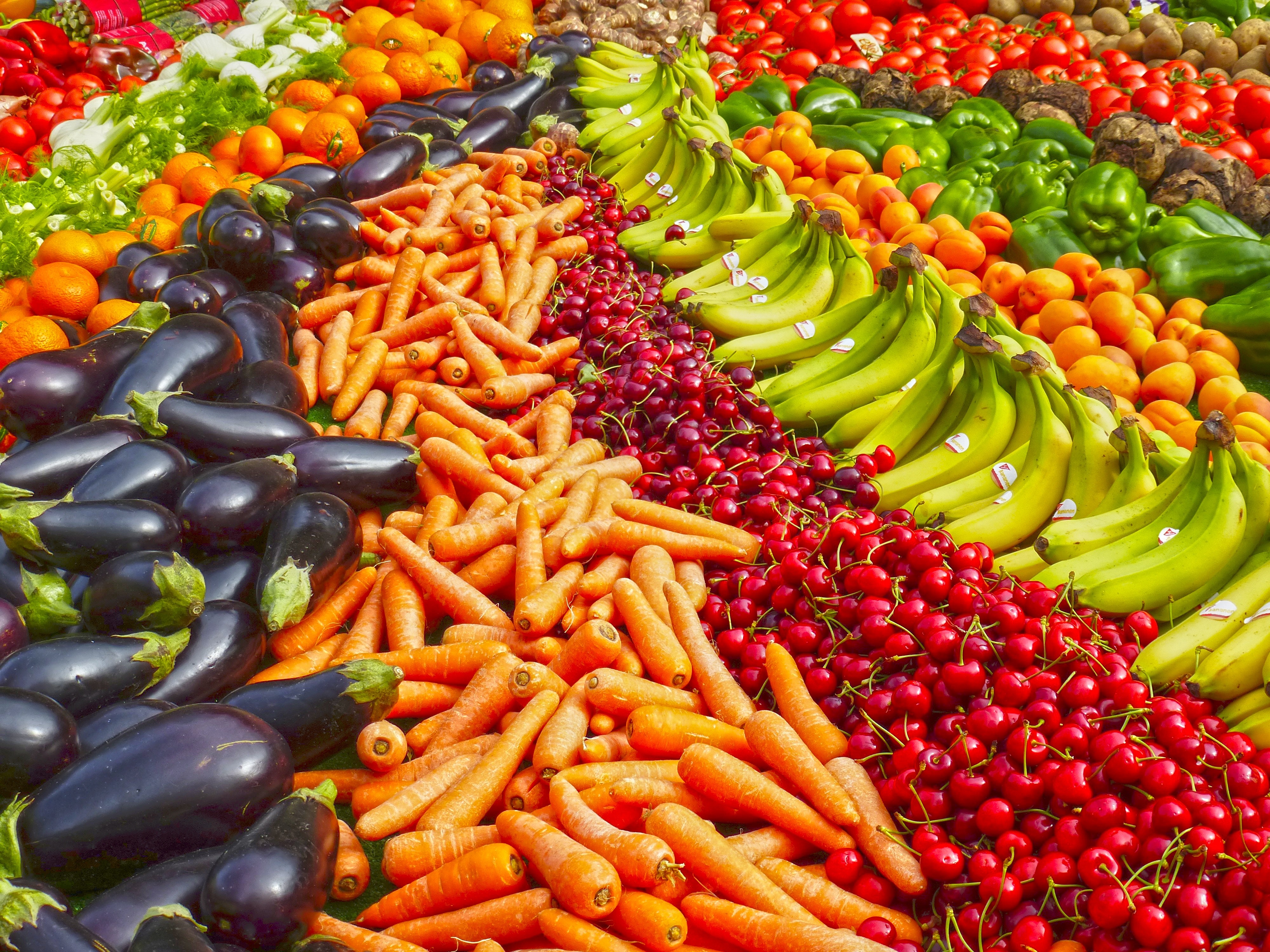 rows of different colored fruits and vegetables